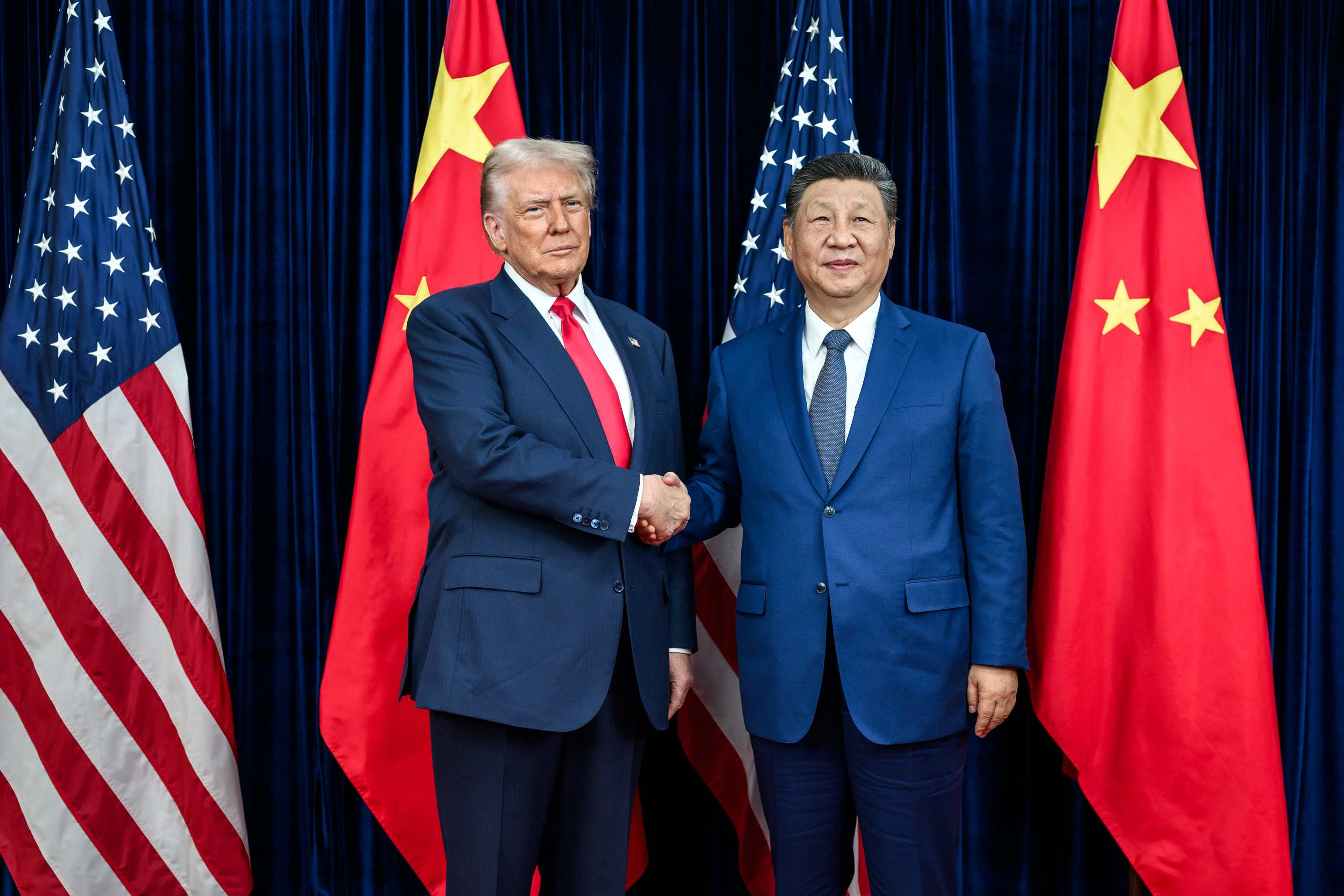 Trump and Xi shake hands before bilateral meeting.